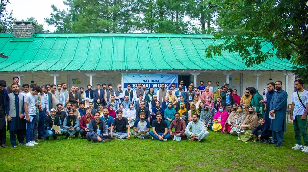 Dignitaries, participants & students at the National Social Work Convention of Pakistan hosted by the Department of Social Work at Baragali Summer Campus. Vice Chancellor Prof. Dr. Johar Ali (center) with the dignitaries and students